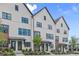 Beautiful townhome showcases a brick facade, black trim, and well-kept landscaping at 656 Soul Aly # 101, Alpharetta, GA 30009