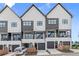 Modern townhouses with striking facades, private balconies, and convenient garage parking at 656 Soul Aly # 101, Alpharetta, GA 30009