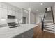 Open kitchen with an island, stainless steel appliances, and plenty of storage space at 656 Soul Aly # 101, Alpharetta, GA 30009