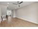 Bright open living area with wood floors, recessed lights and modern railing for stairs at 656 Soul Aly # 101, Alpharetta, GA 30009