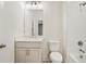 Bathroom featuring vanity with sink, tile shower, and modern fixtures at 656 Soul Aly # 101, Alpharetta, GA 30009