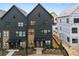 Beautiful new construction townhome with painted brick and modern black window and door trim at 656 Soul Aly # 101, Alpharetta, GA 30009