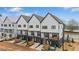Exterior view of new townhomes with modern design and beautiful landscaping at 656 Soul Aly # 101, Alpharetta, GA 30009