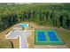 Aerial view of community amenities including a pool and tennis courts at 7678 Gray Pointe Dr, Lithonia, GA 30058