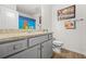 Bright bathroom featuring a granite countertop, updated fixtures, and neutral paint at 7678 Gray Pointe Dr, Lithonia, GA 30058