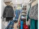 Walk-in closet with shelving and clothing racks for optimal storage at 7678 Gray Pointe Dr, Lithonia, GA 30058