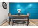 A stylish dining area features an accent wall and comfortable seating at 7678 Gray Pointe Dr, Lithonia, GA 30058