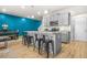 A modern kitchen featuring an island and seating offers an open view to the dining area at 7678 Gray Pointe Dr, Lithonia, GA 30058