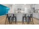 A bright modern kitchen offers an island with seating and stainless steel appliances at 7678 Gray Pointe Dr, Lithonia, GA 30058