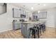 A modern kitchen with an island offers seating, stainless steel appliances, and bright lighting at 7678 Gray Pointe Dr, Lithonia, GA 30058