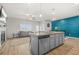 The bright, open-concept living area features a kitchen, dining, and living room at 7678 Gray Pointe Dr, Lithonia, GA 30058