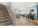 Inviting living area with open floor plan, hardwood floors, and a staircase at 7678 Gray Pointe Dr, Lithonia, GA 30058
