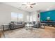 A bright and airy living room features comfortable seating and outdoor views at 7678 Gray Pointe Dr, Lithonia, GA 30058