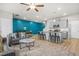 An open-concept living room showcases a kitchen and dining area with bright, natural lighting at 7678 Gray Pointe Dr, Lithonia, GA 30058