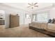Spacious main bedroom features a tray ceiling, plush carpet, and en-suite bathroom access at 7678 Gray Pointe Dr, Lithonia, GA 30058