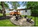 Lush backyard boasting a fire pit and stone, providing a perfect space for relaxation and outdoor gatherings at 2171 Plantation Ln, Chamblee, GA 30341