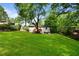 The backyard features a well-maintained lawn, a deck, a fire pit area, and mature trees at 2171 Plantation Ln, Chamblee, GA 30341