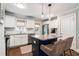Well-lit kitchen featuring granite counters, stainless steel appliances, and a center island with seating at 2171 Plantation Ln, Chamblee, GA 30341