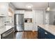 Charming kitchen with granite countertops, stainless appliances, and hardwood floors at 2171 Plantation Ln, Chamblee, GA 30341