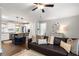 Open layout showing the living room seamlessly connecting to a modern kitchen with a navy island at 2171 Plantation Ln, Chamblee, GA 30341