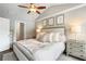 Bright and airy primary bedroom with vaulted ceiling, ceiling fan, and ensuite bathroom at 2171 Plantation Ln, Chamblee, GA 30341
