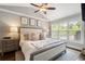 Bright and airy primary bedroom with vaulted ceiling, ceiling fan, and large windows at 2171 Plantation Ln, Chamblee, GA 30341