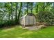 View of the property featuring a shed surrounded by lush greenery at 2171 Plantation Ln, Chamblee, GA 30341