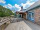 Beautiful back deck with pergola, brick accents, and blue trim, perfect for outdoor relaxation at 2347 Univeter Rd, Canton, GA 30115