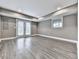 Spacious basement area with light gray walls, recessed lighting, and wood-look flooring at 2347 Univeter Rd, Canton, GA 30115