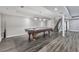 Finished basement features a pool table and a stairway with modern wood-look flooring at 2347 Univeter Rd, Canton, GA 30115