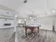 Finished basement with a pool table under a pendant light and wood-look flooring at 2347 Univeter Rd, Canton, GA 30115