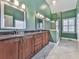 Bathroom with dual vanities, granite countertops, and glass shower at 2347 Univeter Rd, Canton, GA 30115
