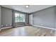 Spacious bedroom with hardwood floors and neutral paint at 2347 Univeter Rd, Canton, GA 30115