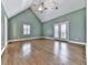 Spacious bedroom features vaulted ceiling and hardwood floors at 2347 Univeter Rd, Canton, GA 30115