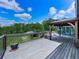 Relax on the expansive deck overlooking the yard, offering a serene outdoor retreat perfect for enjoying nature at 2347 Univeter Rd, Canton, GA 30115