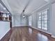 Bright dining area with modern lighting, neutral tones, hardwood floors, and seamless access to the kitchen at 2347 Univeter Rd, Canton, GA 30115