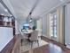 Bright dining area with modern lighting, neutral tones, hardwood floors, and seamless access to the kitchen at 2347 Univeter Rd, Canton, GA 30115