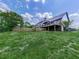 Features a multi-level deck, perfect for outdoor entertaining and relaxing with views of the lush backyard and surrounding landscape at 2347 Univeter Rd, Canton, GA 30115