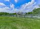 Stately home framed by lush greenery and a classic black wooden fence evokes Southern charm and elegance at 2347 Univeter Rd, Canton, GA 30115