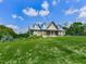 A beautiful home boasts meticulous landscaping, enhancing its curb appeal with lush greenery and a well-maintained lawn at 2347 Univeter Rd, Canton, GA 30115