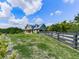Exterior view of a charming blue home with a lush green lawn at 2347 Univeter Rd, Canton, GA 30115