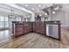 Kitchen area with breakfast bar, stainless steel dishwasher, granite countertops and custom cabinets at 2347 Univeter Rd, Canton, GA 30115
