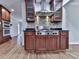 Gourmet kitchen featuring stainless steel appliances, granite counters, tiled backsplash and plenty of wood cabinets at 2347 Univeter Rd, Canton, GA 30115