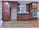 Open concept kitchen with wooden cabinets, granite countertops, stainless steel microwave and oven at 2347 Univeter Rd, Canton, GA 30115