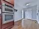 Kitchen appliances with custom cabinets, granite countertops, stainless steel oven, and stainless steel microwave at 2347 Univeter Rd, Canton, GA 30115