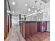 A gourmet kitchen boasts a wine rack, a breakfast bar, granite countertops, and pendant lighting at 2347 Univeter Rd, Canton, GA 30115