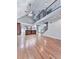 Spacious living room featuring vaulted ceilings, wooden floors, and staircase to the second floor at 2347 Univeter Rd, Canton, GA 30115