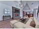Inviting living room featuring a cozy fireplace, hardwood floors, and a stylish sectional sofa for relaxation at 2347 Univeter Rd, Canton, GA 30115