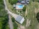 Aerial image displaying a backyard pool, patio area, gazebo, and well-maintained landscaping at 2347 Univeter Rd, Canton, GA 30115