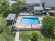Aerial close up of pool with diving board, gazebo, flagstone patio and a fenced in yard at 2347 Univeter Rd, Canton, GA 30115